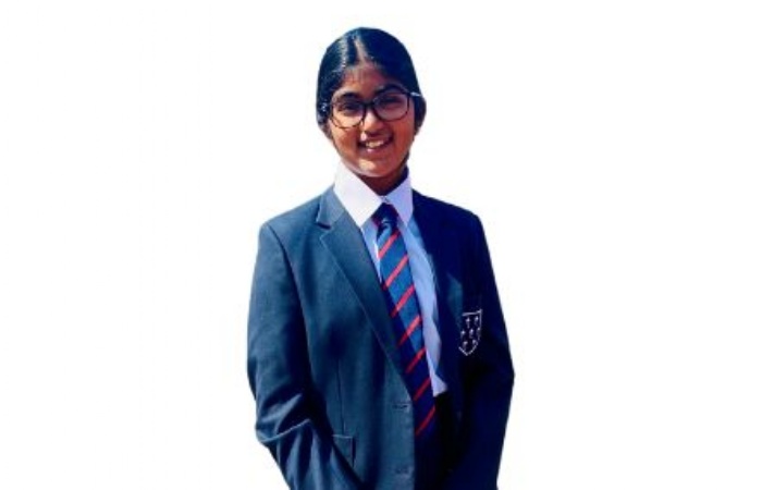 Pupil in a navy blue school uniform